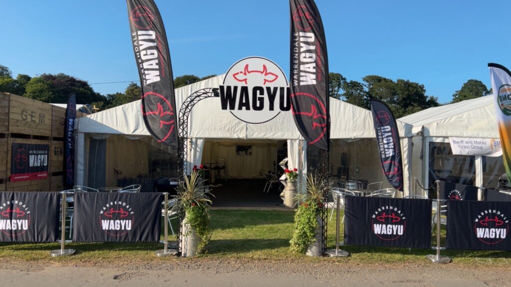 Wagyu marquee with flags and branded banners